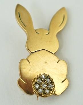 A 9ct gold rabbit brooch, the tail set with eight small diamonds, London 1975, maker VE, 28mm, gross weight 4.7 grams. Condition - fair